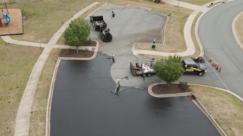 Applying sealcoating after crack repair