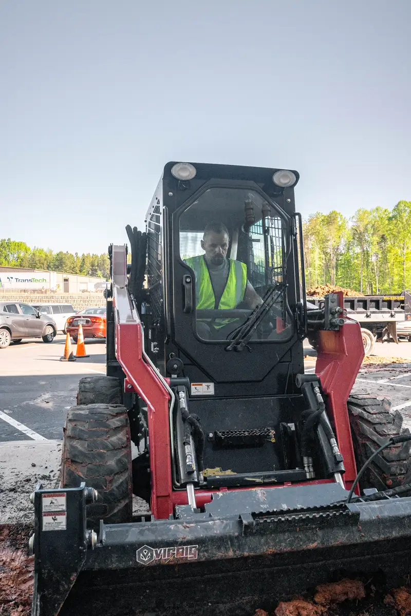 Extracting-4-inches-deep-of-dirt-around-the-washout-area-to-prepare-for-paving