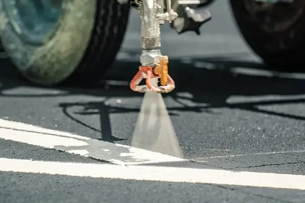 close up view of line striping parking lot lines at point blank range in matthews nc
